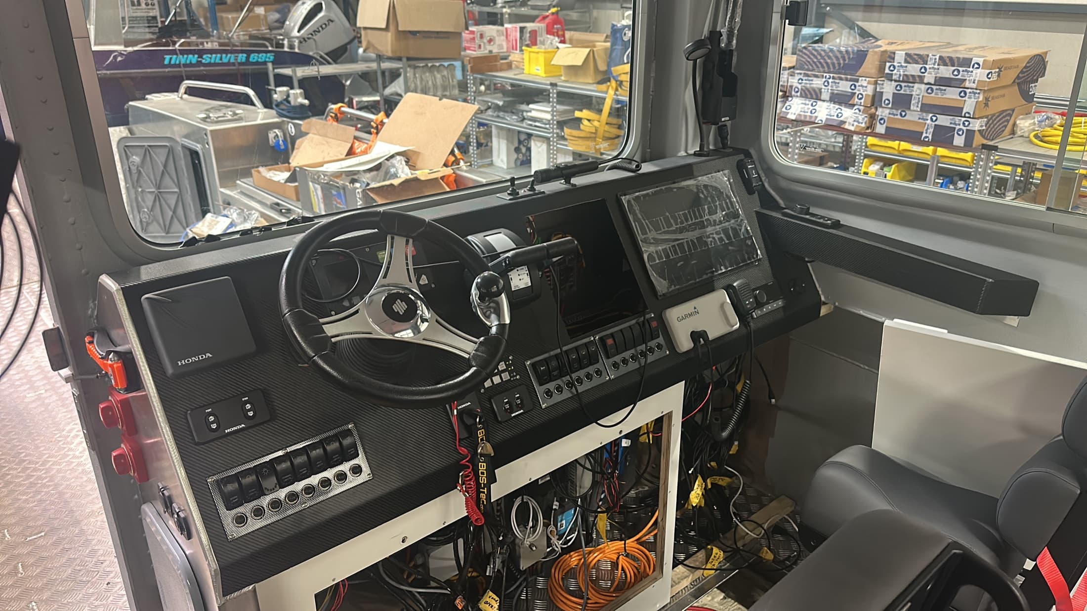 Professional workboat helm with navigation screens and controls