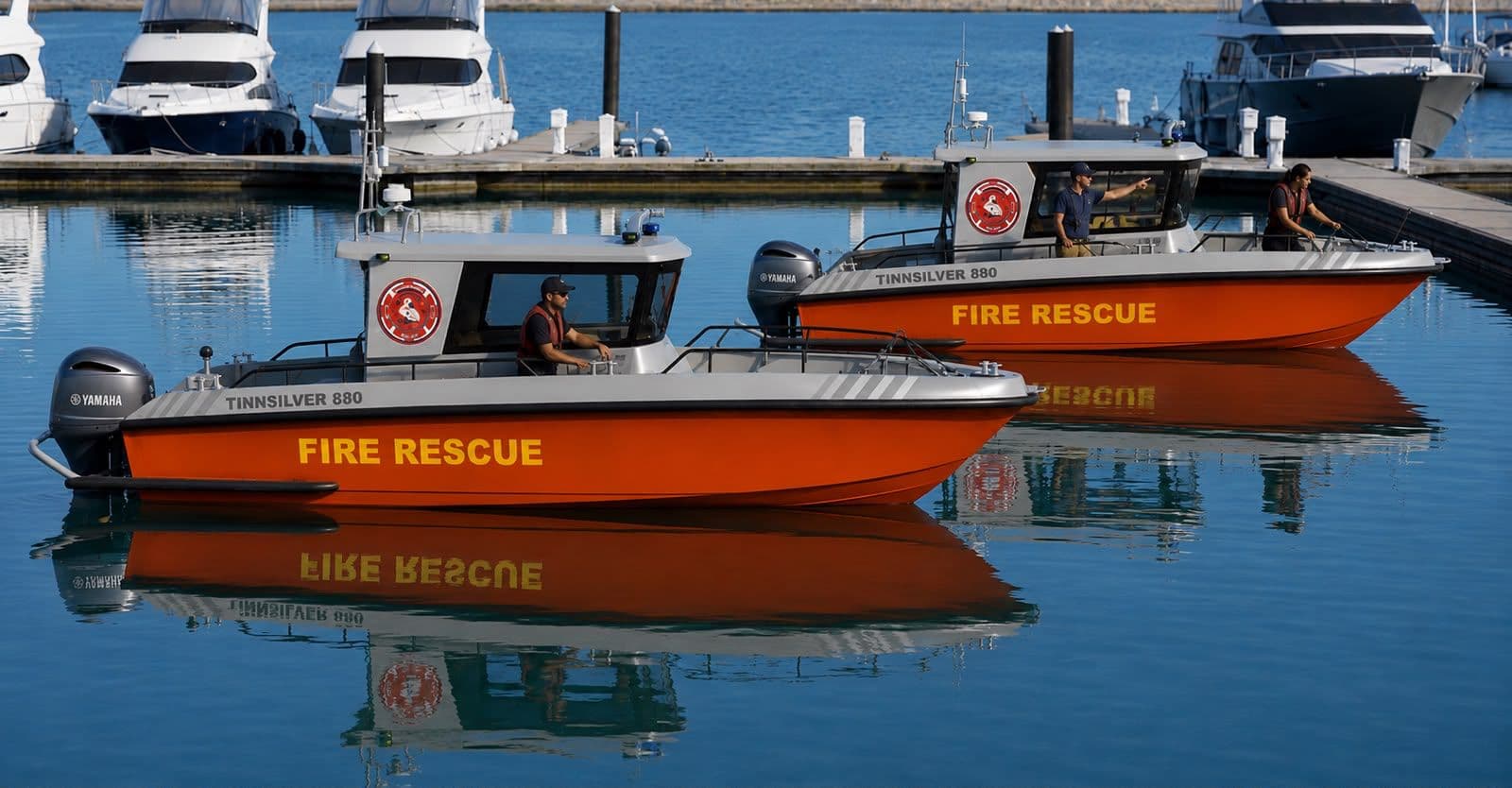 Two Tinn Silver fire rescue boats on the water
